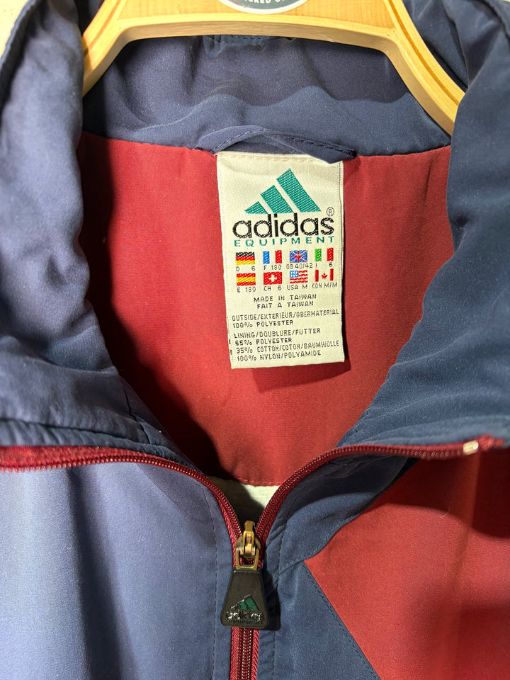 Adidas Equipment Etikett mit Größenangabe L und Materialangaben